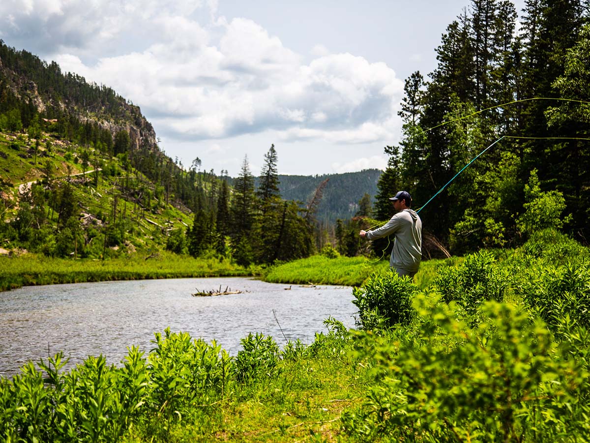 Fly fishing in the mountains at Deer Mountain Village.