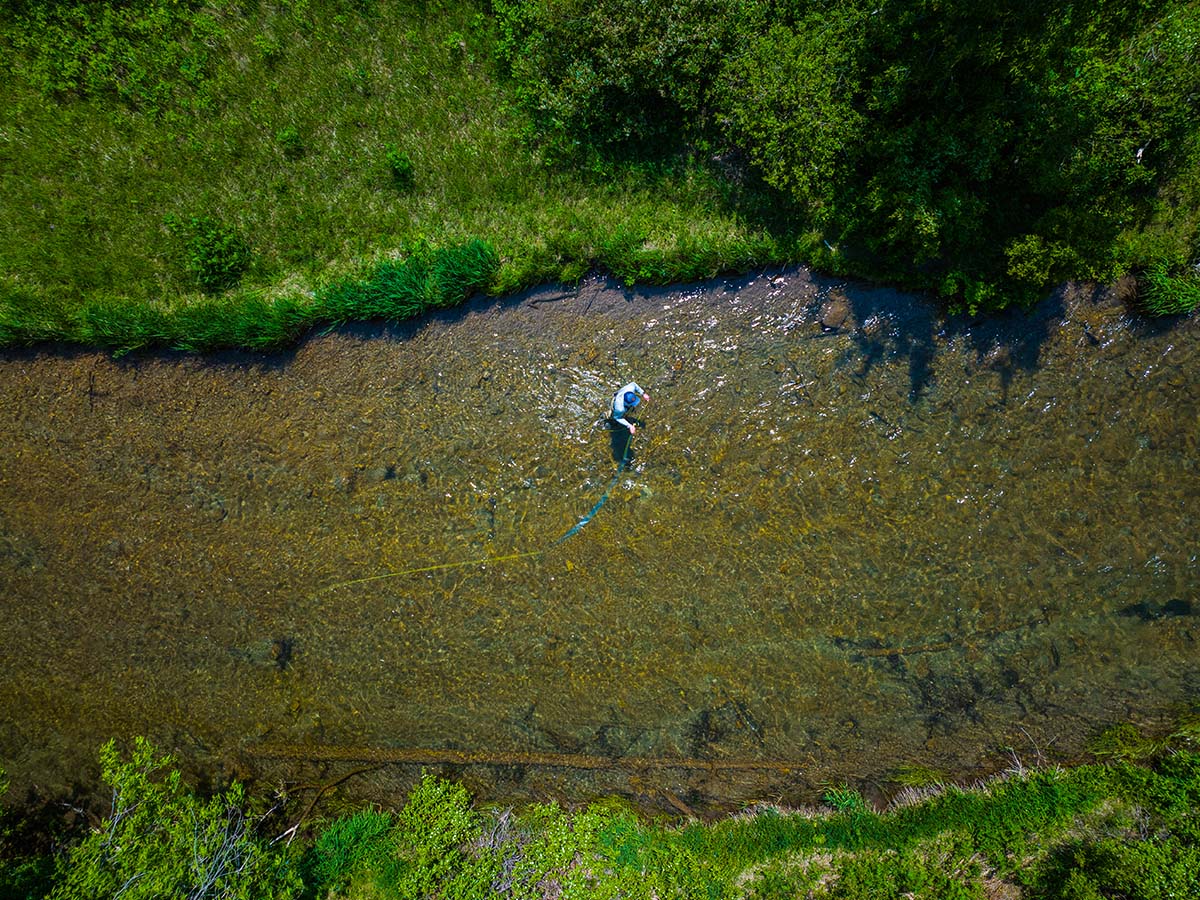 Aerial view of a man flying fishing.