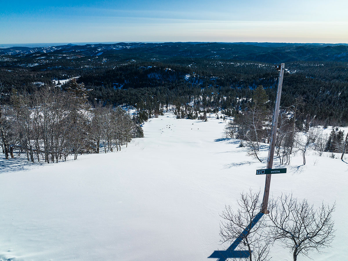 Snow covered ski slopes.